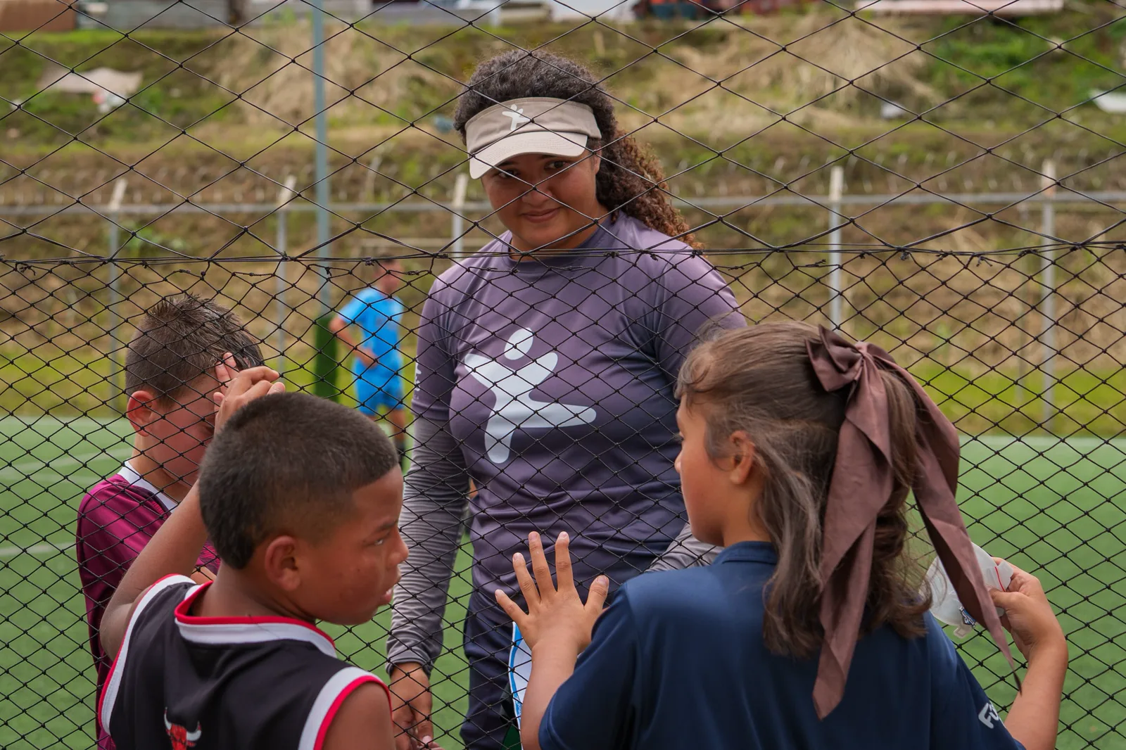 Visiting and local players high fiving after a community match
